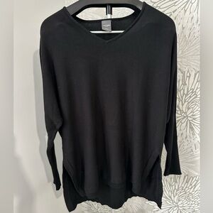 Black v neck sweater Tight around around forearms